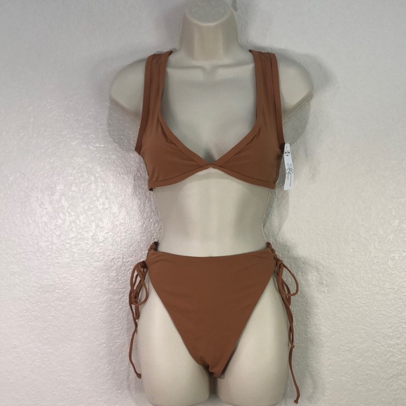 Dippin' Daisy's Other - Dippin Daisy’s Tan in color size Large Top NWT Top tie’s Bottoms ties on side